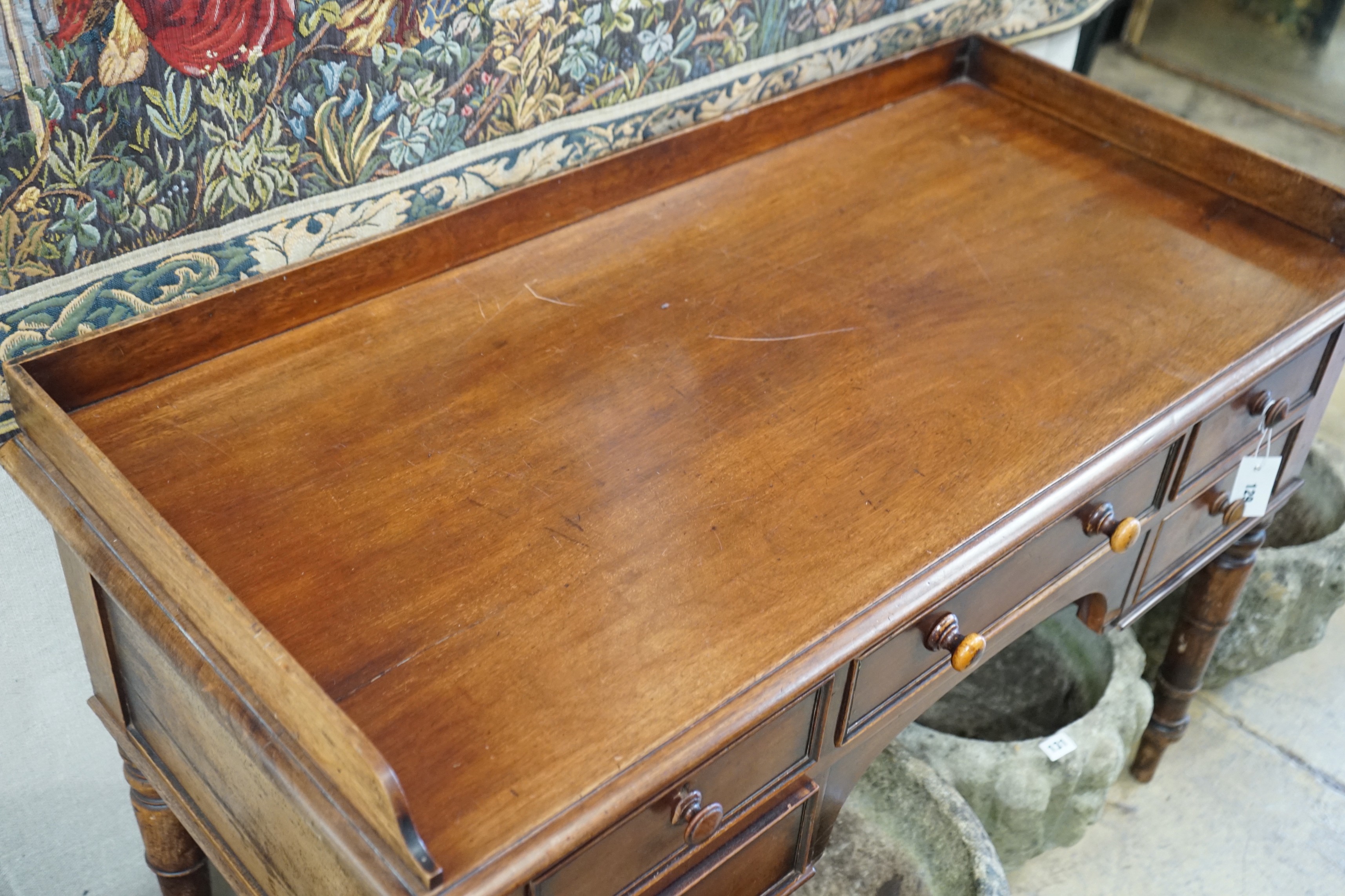 A Victorian mahogany kneehole dressing table, width 112cm, depth 52cm, height 79cm